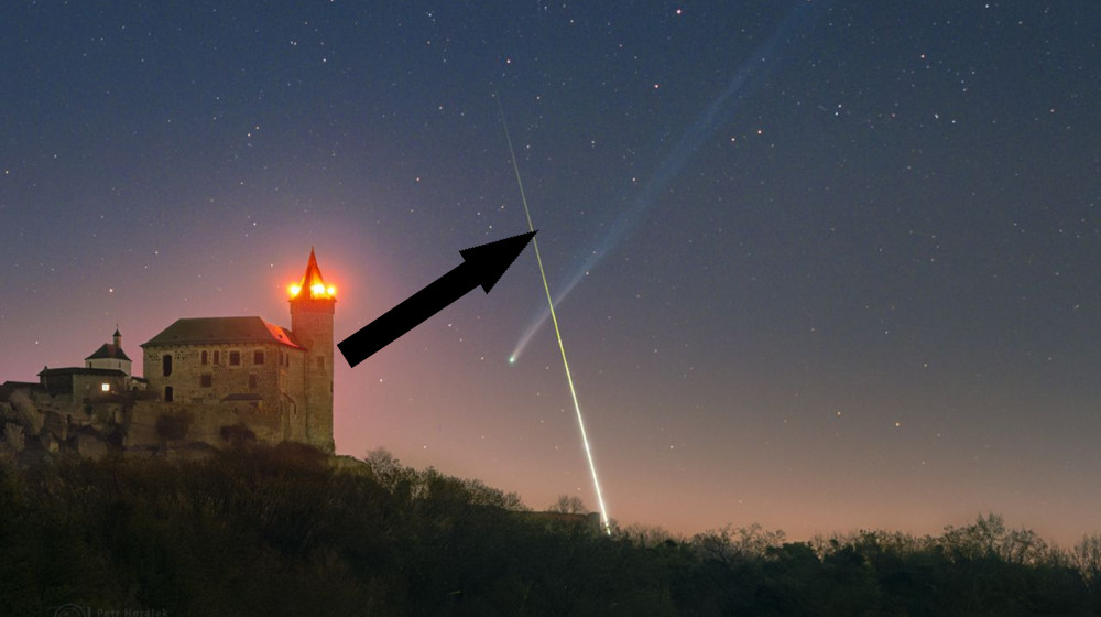  'What are the odds': Superbright comet and exploding fireball meteor form near-perfect X over European castle 